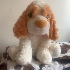 Soft plush stuffed puppy. White and tan red collar.